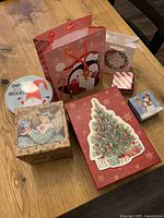 Group shot of all gift boxes, bags and tin on table