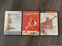 Three yoga DVDs front covers visible