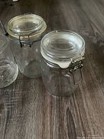 Close view of two clamp jars showing gasket and wire mechanism