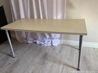 Full view of desk showing top and legs