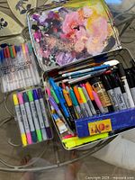 Open tin showing mixed Sharpie markers, Colour Luxe gel pen pack, Copic markers pack, Wachsfolien wax sheets