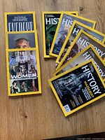 All nine magazines spread on wooden surface