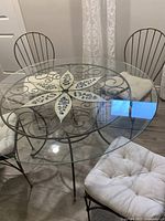 Table and three chairs showing overall design