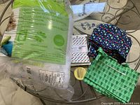 Full lot with fiberfill bag, three folded fabrics, needle case