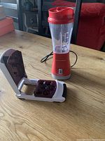 Overall view of blender and cherry pitter on table