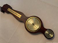 Full view of the 17.5-inch wooden wall instrument showing the thermometer at top, barometer center, and hygrometer at bottom