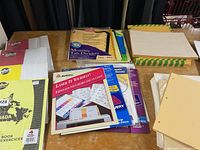 Overall view of dividers, labels, paper packs and envelopes on tabletop