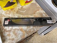 Knife in original box on countertop