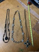 Three necklaces laid out for full view