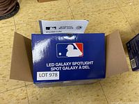 Closed retail box labeled LED Galaxy Spotlight with MLB logo