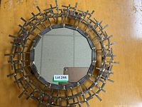 Full view of round metal framed mirror