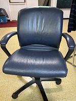 Front view of blue swivel office chair