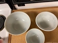 Top view of three nested Pyrex mixing bowls