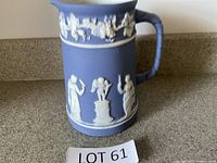 Front view showing relief figures and garlands