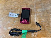 Front view of Sony Walkman NWZ-S544 and USB charging cable