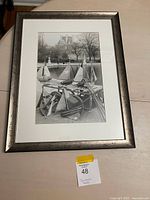 Full view of framed photograph lying on table