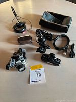 Overview of all items including dash cam, cables, headlamp, microphone, lens case, pouch
