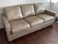 Front view of leather sofa showing overall style and condition
