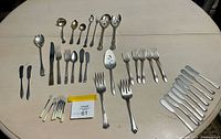 Overview of entire flatware lot on table