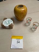 Group shot showing vase, coaster set in holder, two shot glasses