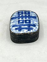 Porcelain and pewter shard box with blue-on-white porcelain lid featuring the Double Happiness character and repoussé pewter floral embossed body.