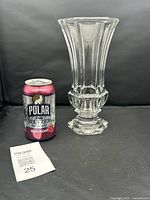 Full view of vintage Bohemian crystal vase next to soda can for size reference, showing fluted vertical cuts and overall shape.
