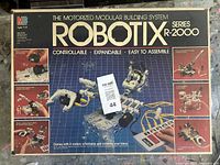Box for the Robotix R-2000 motorized modular building system showing full branding and model series with images of built robot models and motorized features.