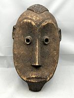 Full front view of the mask against white background.