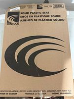 Box for the Centoco solid plastic toilet seat, showing product name and brand information.