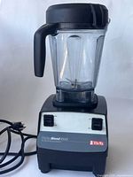 Vitamix TurboBlend 4500 blender showing full unit with cord and container, front and side views.