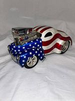 Front angle view of the hot rod diecast car showing blue front with white stars and chrome engine detail