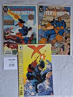 Two DC Deathstroke The Terminator comics and one DarkHorse Heroes X comic arranged side by side on a light surface.