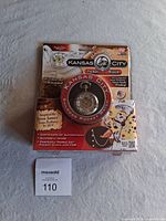 Front view of the Kansas City Railroad pocket watch sealed in original packaging with chain and fob.