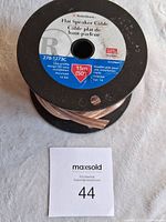 Photo of spool with label showing RadioShack branding, model 278-1273C, 14 gauge flat speaker cable, 15m length stated.