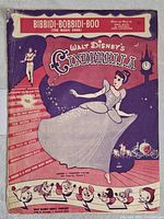 Photograph of the front cover of vintage 1949 sheet music titled Bibbidi-Bobbidi-Boo (The Magic Song) from Walt Disney's Cinderella featuring colorful illustration of Cinderella and related characters.