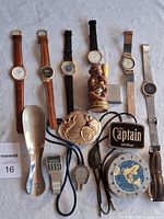 Overview of wristwatches and accessories on white background