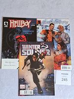 Photo showing Winter Soldier, HellBoy, and Serenity comics together