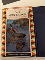 Front cover of 'Poor Mrs. Quack' showing an illustrated duck family in a pond environment, part of The Bedtime Story-Books series.