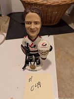 Front view of the bobblehead doll showing the detailed facial features, Team Canada jersey, goalie stick, and mask.