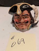 Front view of the Royal Doulton Toby Mug depicting Capt Henry Morgan with detailed facial features and tricorne hat.