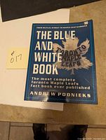 Front cover of 'The Blue and White Book' Toronto Maple Leafs fact book by Andrew Podnieks.