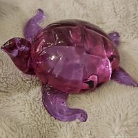 Top view of purple heavy art glass turtle showing detailed shell and front legs