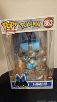 Front view of boxed Lucario jumbo Funko Pop figure showing packaging branding including Pop! Games, Pokemon logo, and number 863.