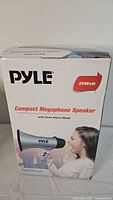 Box front showing Pyle logo, product image of blue megaphone, 20 watt specification and siren alarm mode feature.