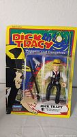 Full front view of Dick Tracy action figure in original packaging with loose packaging noted.