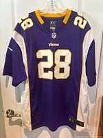 Front view of the purple Minnesota Vikings jersey with number 28.