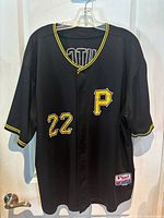 Front view of black Pittsburgh Pirates baseball jersey with number 22 and 'P' logo.