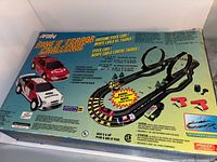 Original box with trace layout graphic and car illustrations