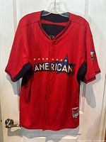 Front of the red American League 2014 All Star Game jersey with 'AMERICAN' across chest