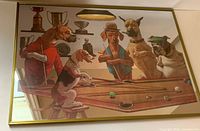 Frontal view of the vintage mirror showing the entire dogs playing pool artwork and gold frame.